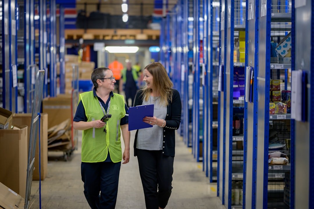 Warehouse team reviewing inventory paperwork during a product authenticity check